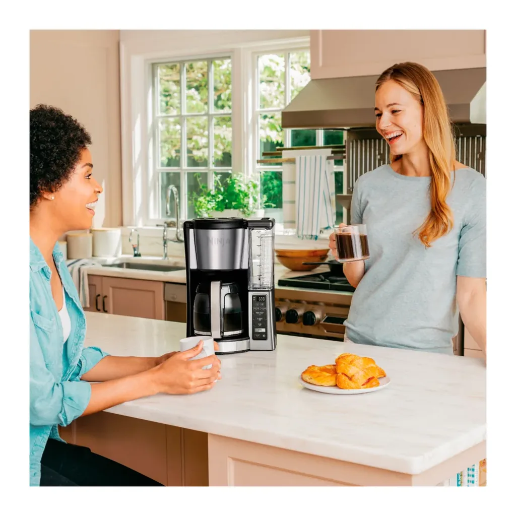 Ninja CE251 - Coffee serving lifestyle view Ninja CE251 silver 12-cup coffee brewer - coffee serving lifestyle view